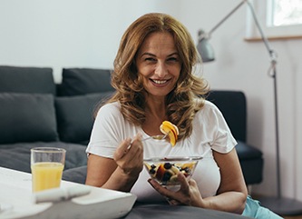  Woman smiling with a dental bridge in Dix Mills