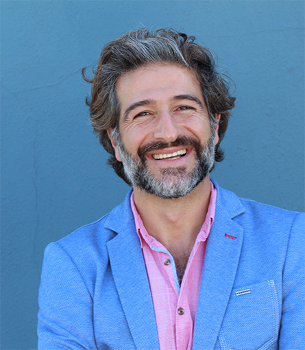 Bearded man in blue button-up jacket