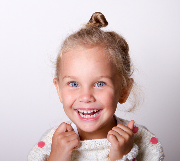 Little girl wearing a sweater