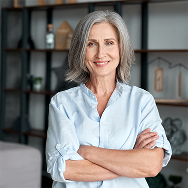 Woman smiling with arms folded