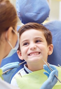 a child patient smiling during a dental visit
