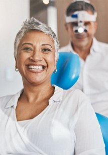 a patient smiling after undergoing restorative dentistry