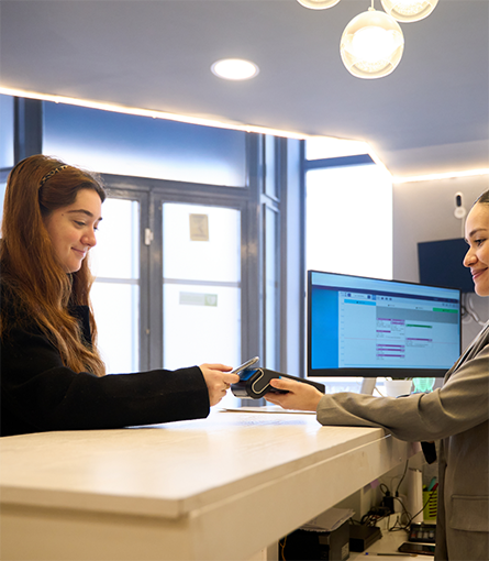 Holding out credit card reader for patient