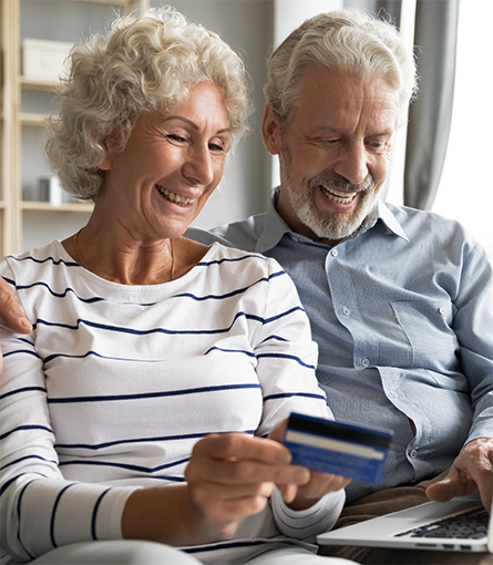Older man and woman with credit card
