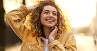 Woman with curly hair smiling