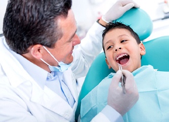 Dentist with young boy