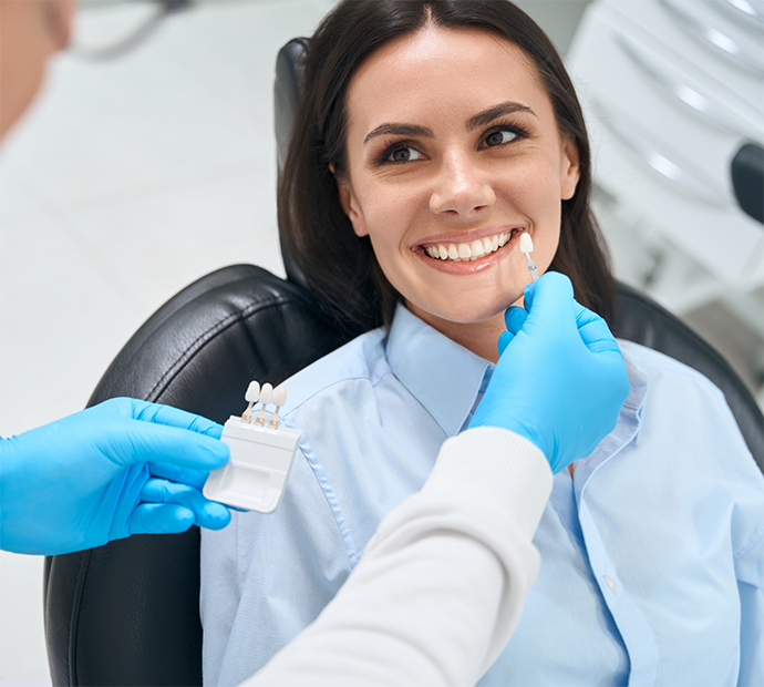 Female patient having teeth shade matched for veneers