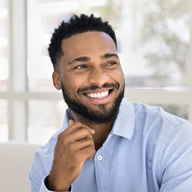 Smiling man in button up shirt