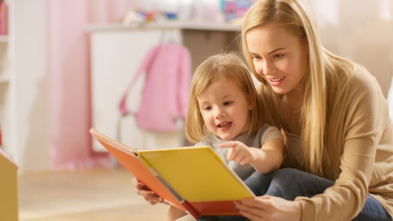 Mother and child reading children’s book