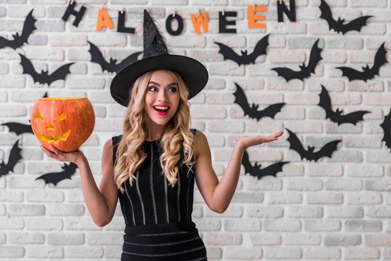 female dressed as a witch for Halloween